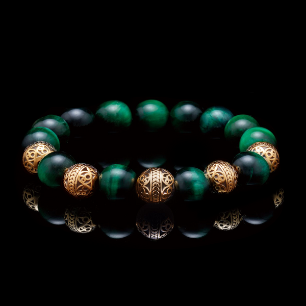 Possessing energy as dominating as its name, the Alpha is a green tiger eye bracelet with a selection of gold classic and green tiger gems. The green tiger eye bracelet promotes protective properties that will shield the wearer from harm through its observing green hue. The golden beads also reflect a luxurious ambiance, and in combination with the green tiger eye bracelet, will give an elevated sense of clarity.