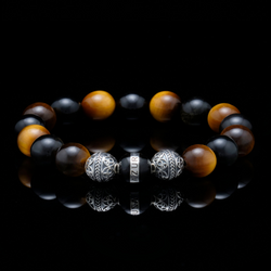Named after the greatest martial arts film, The Crouching Tiger praises those who dedicate their spirit and sweat to defend their legacy and lead others to triumph over obstacles. Fusing the elements of calmness and steadiness from tiger eye bracelet and gold obsidian bracelet, the Crouching Tiger is deemed as one of the most majestic bracelets for men, granting the power to face the most ferocious storms.